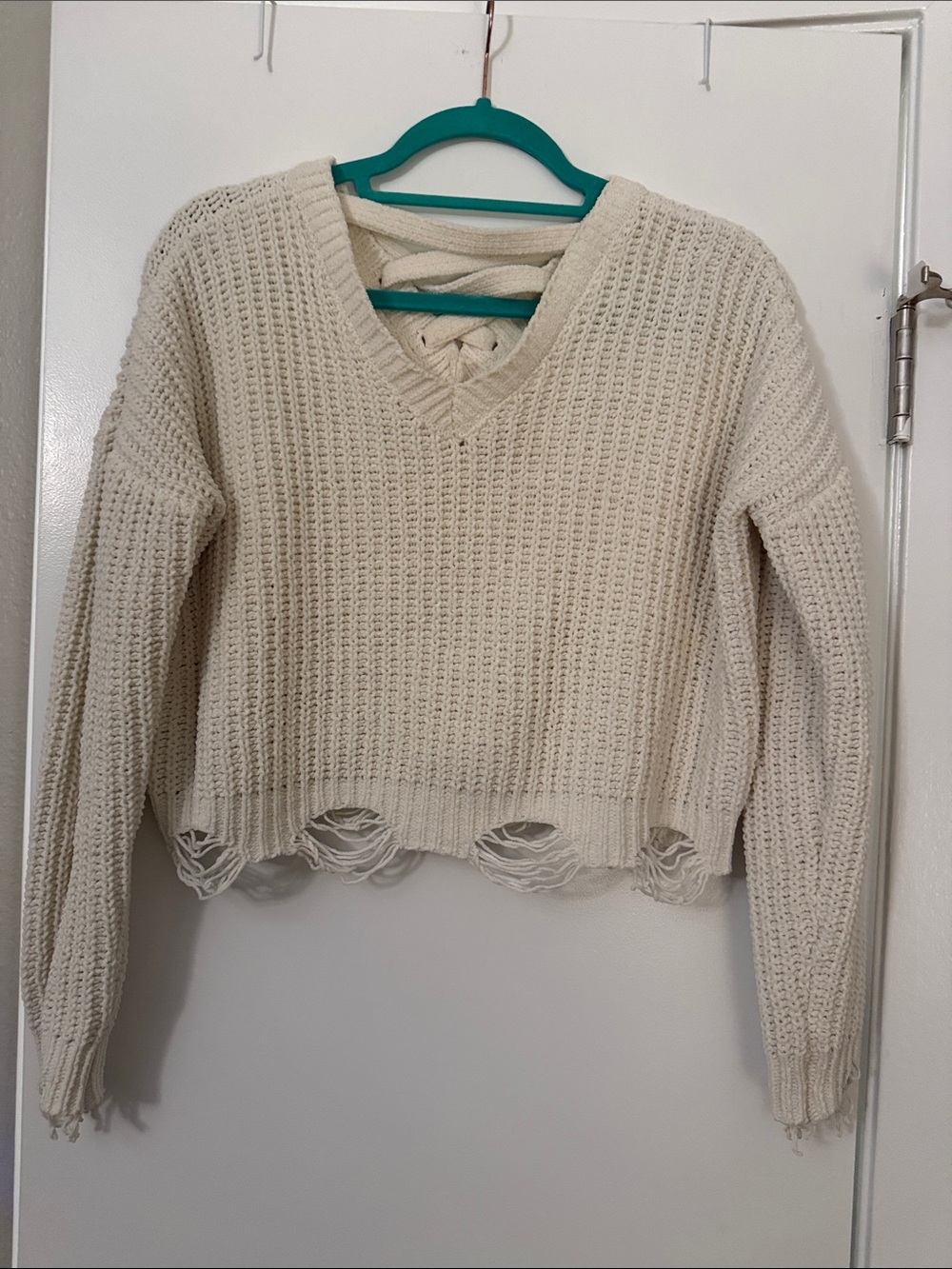 Hazel Moon Distressed Crochet-Style V-Neck Sweater in Cream